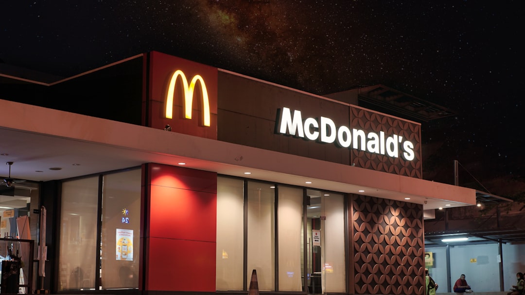 McDonald's illuminated at night, a perfect backdrop for enjoying decaf iced coffee.