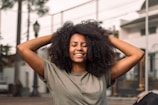 a woman with her hands on her head