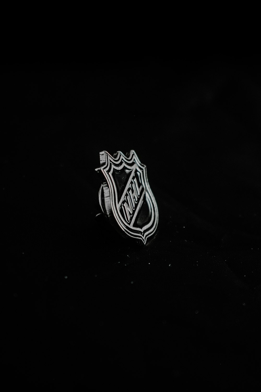 a close up of a hockey logo on a black background