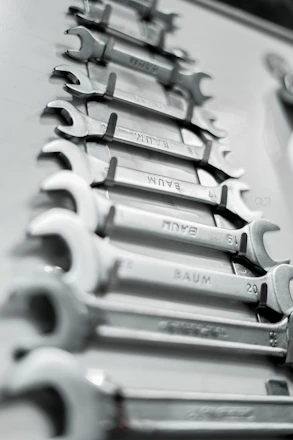 a bunch of wrenches are lined up on a table