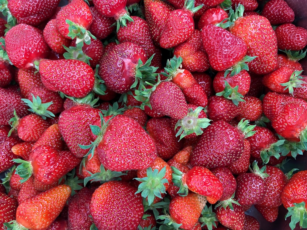 a close up of a bunch of strawberries