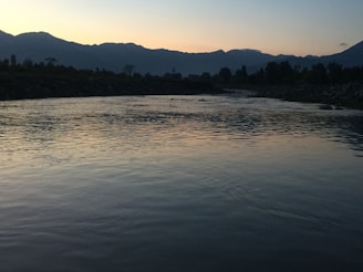 Sunset over the river valley, inviting calm and reflection after a day of rafting and yoga.