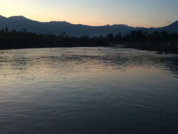 Sunset over the river valley, inviting calm and reflection after a day of rafting and yoga.