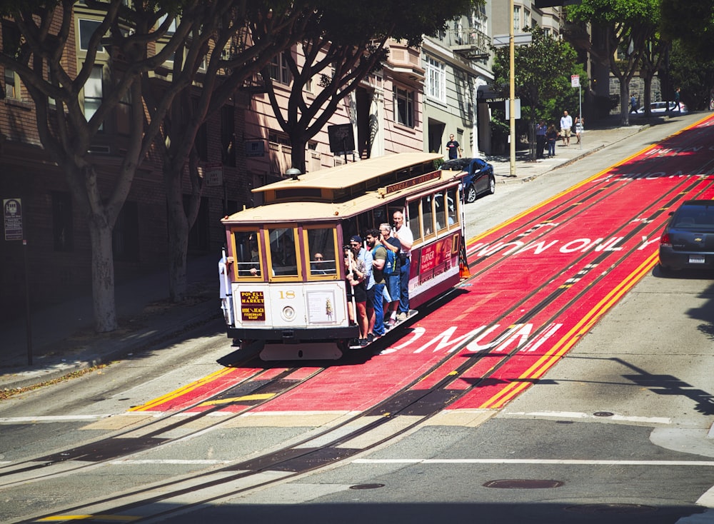 a cable car traveling down a city street