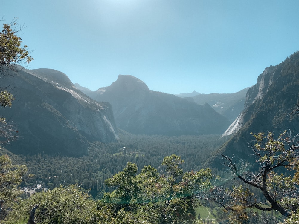 a view of a valley with mountains in the background