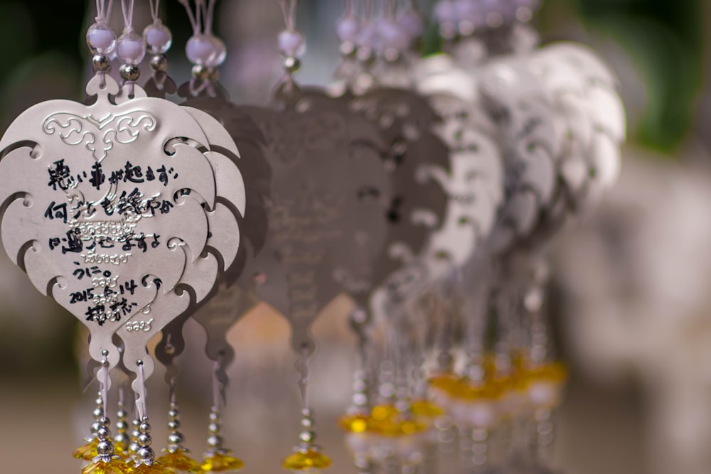 a group of hanging decorations with chinese writing on them