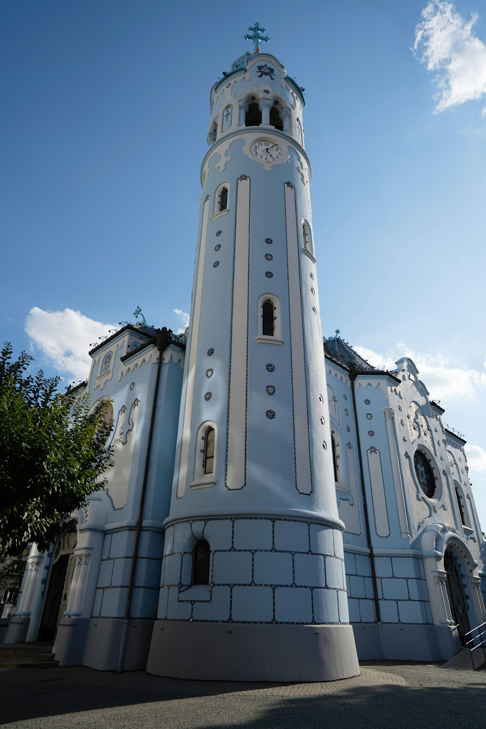 a large white building with a clock on it's side