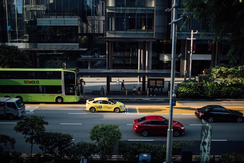 yellow and black cars on road near building during daytime