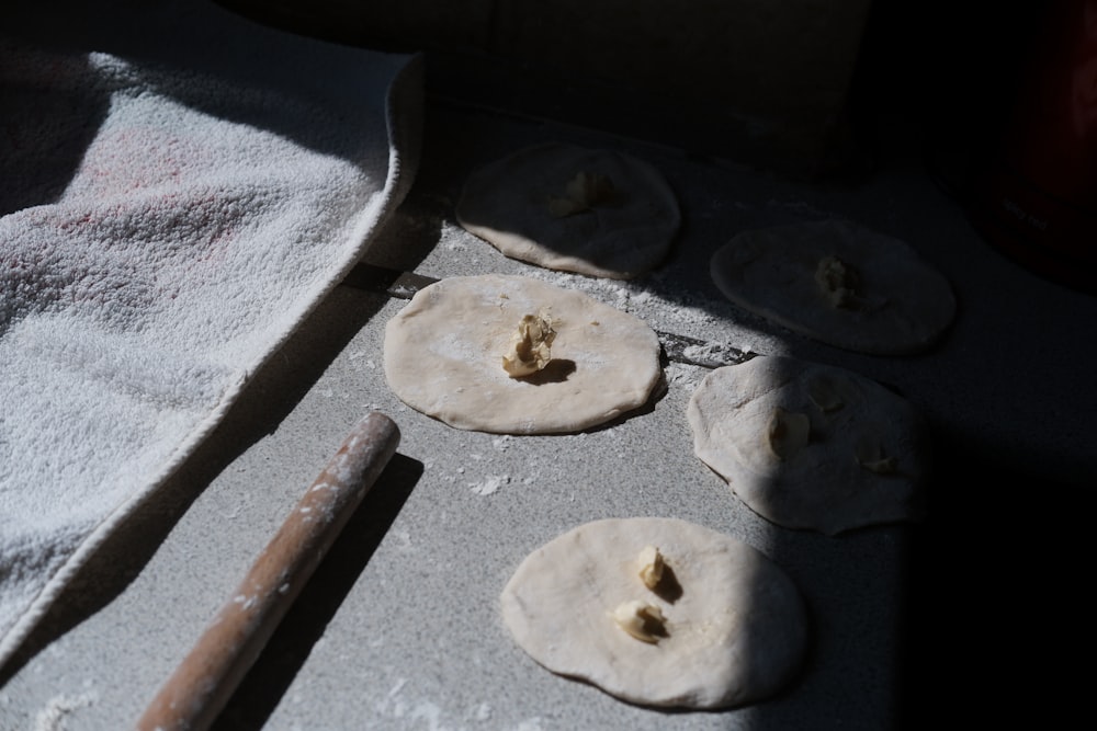 a couple of doughs sitting on top of a pan