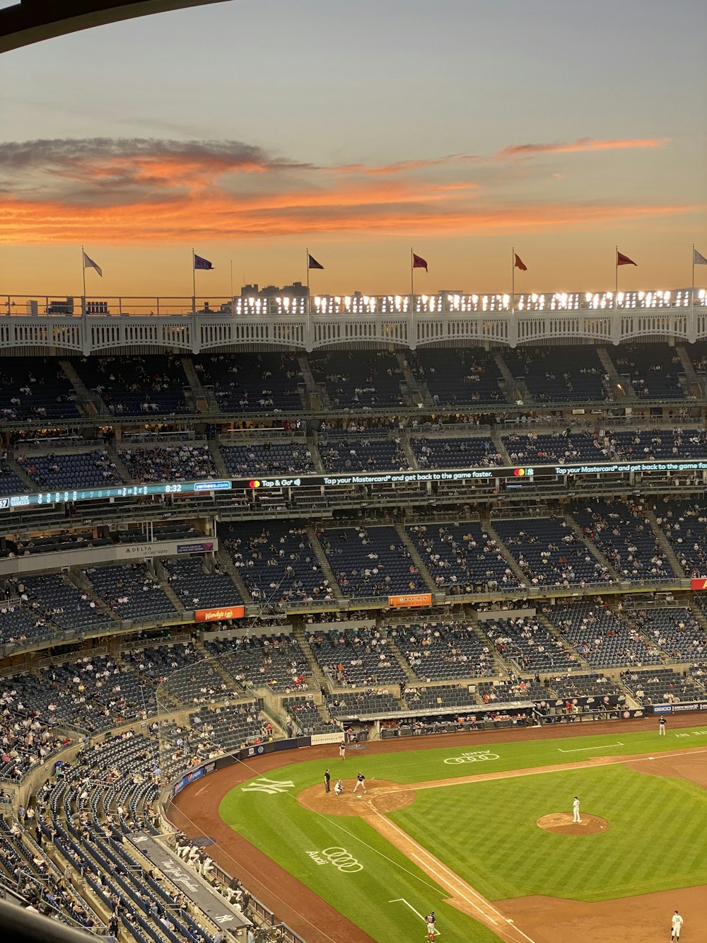people on stadium during sunset