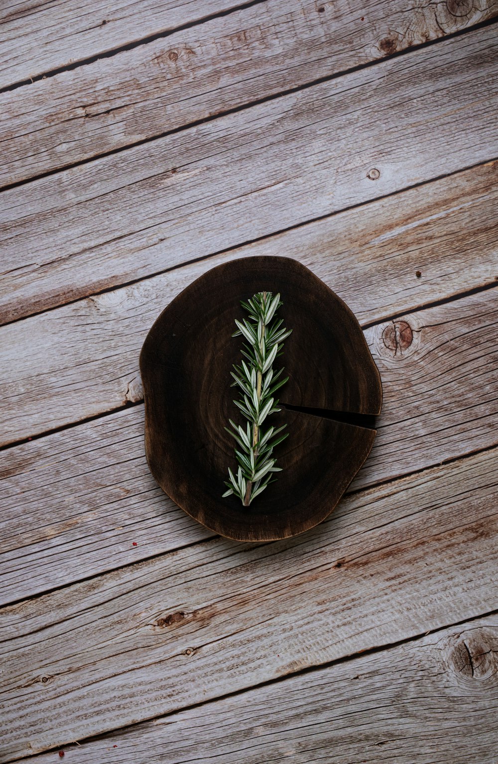 a piece of wood sitting on top of a wooden table