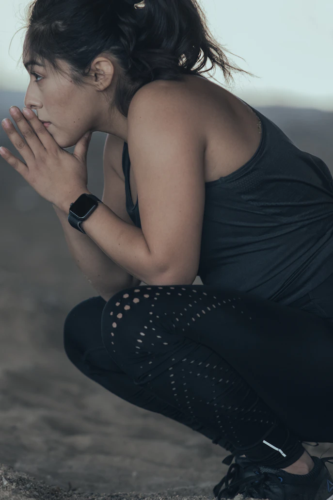 Woman checking fitness tracker during walk