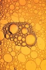 water droplets on yellow surface