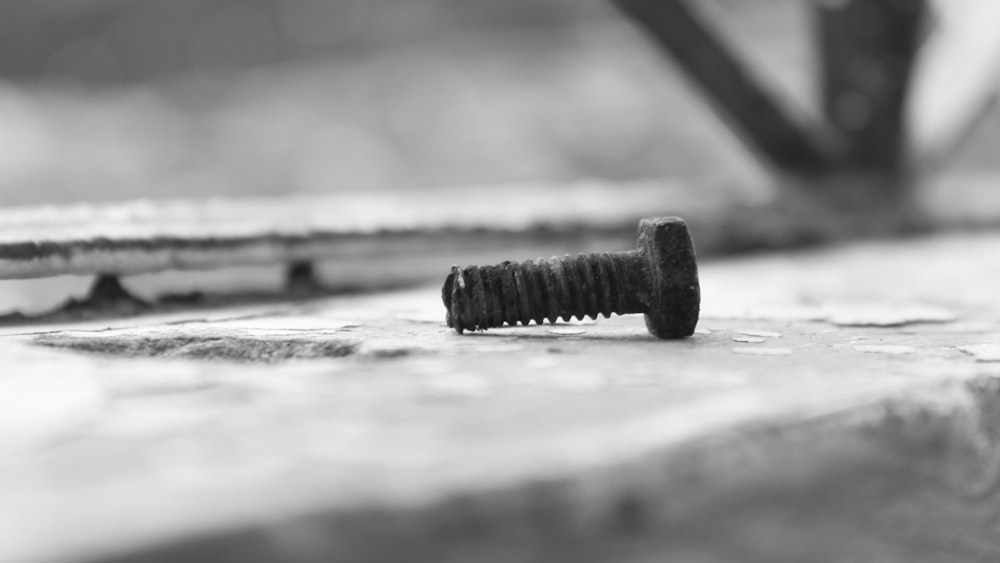 a black and white photo of a screw
