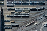 a train yard with many trains on the tracks