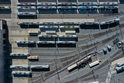 a train yard with many trains on the tracks