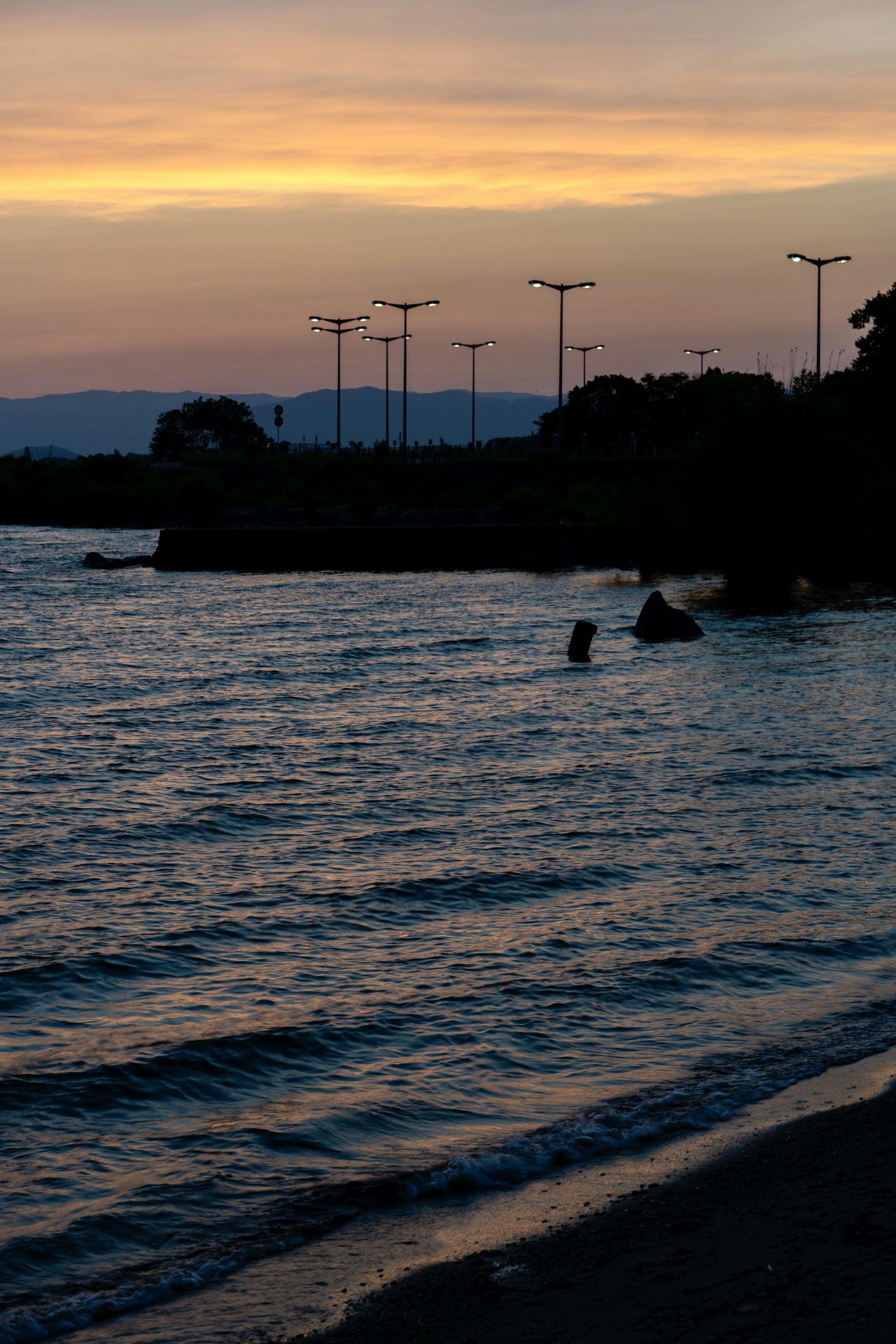 a body of water that has some lights on it