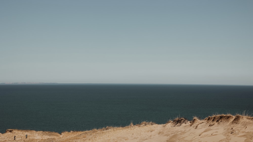 a view of the ocean from a sand dune