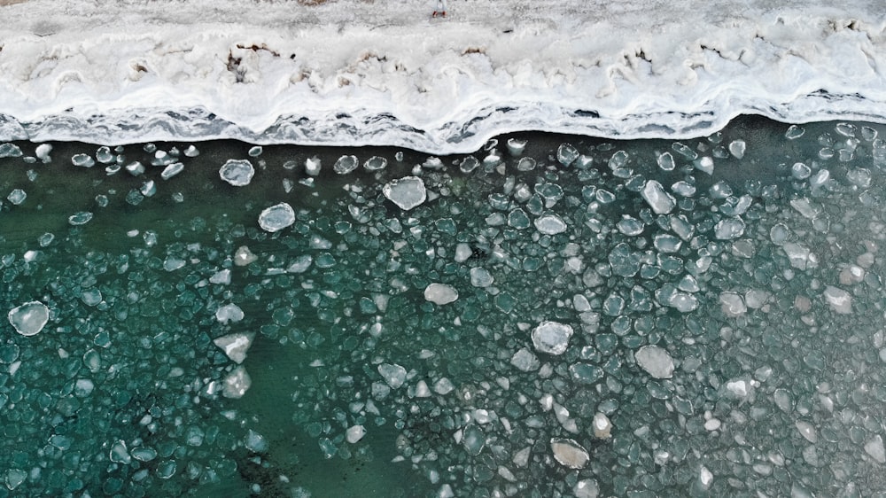 an aerial view of a body of water covered in ice