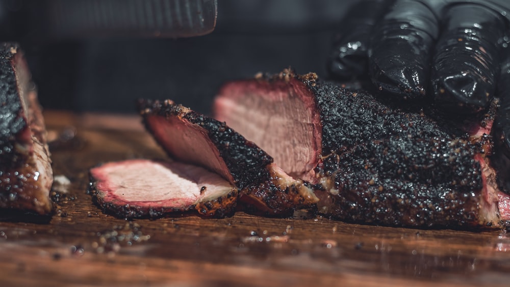 sliced meat on brown wooden chopping board