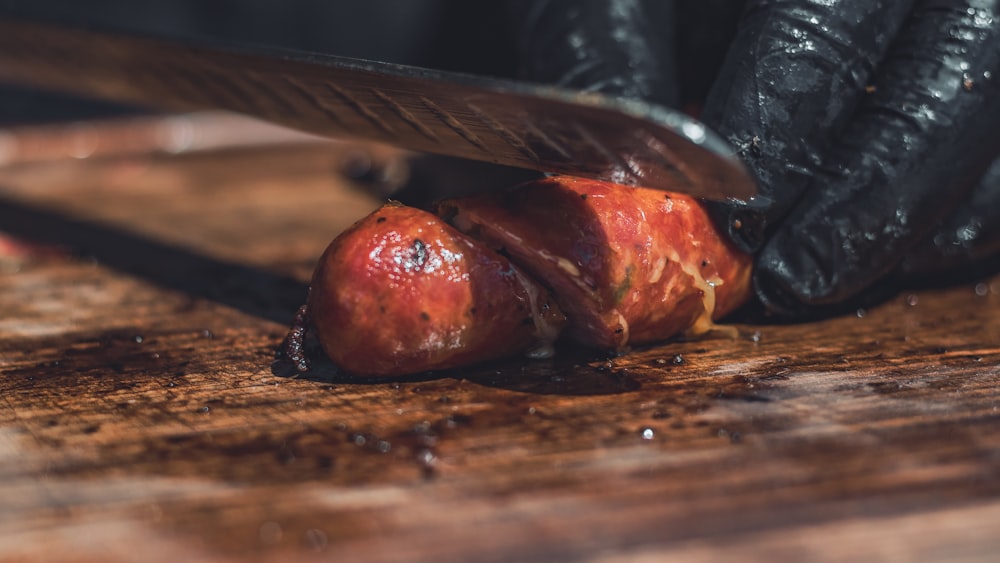 sliced meat on brown wooden chopping board