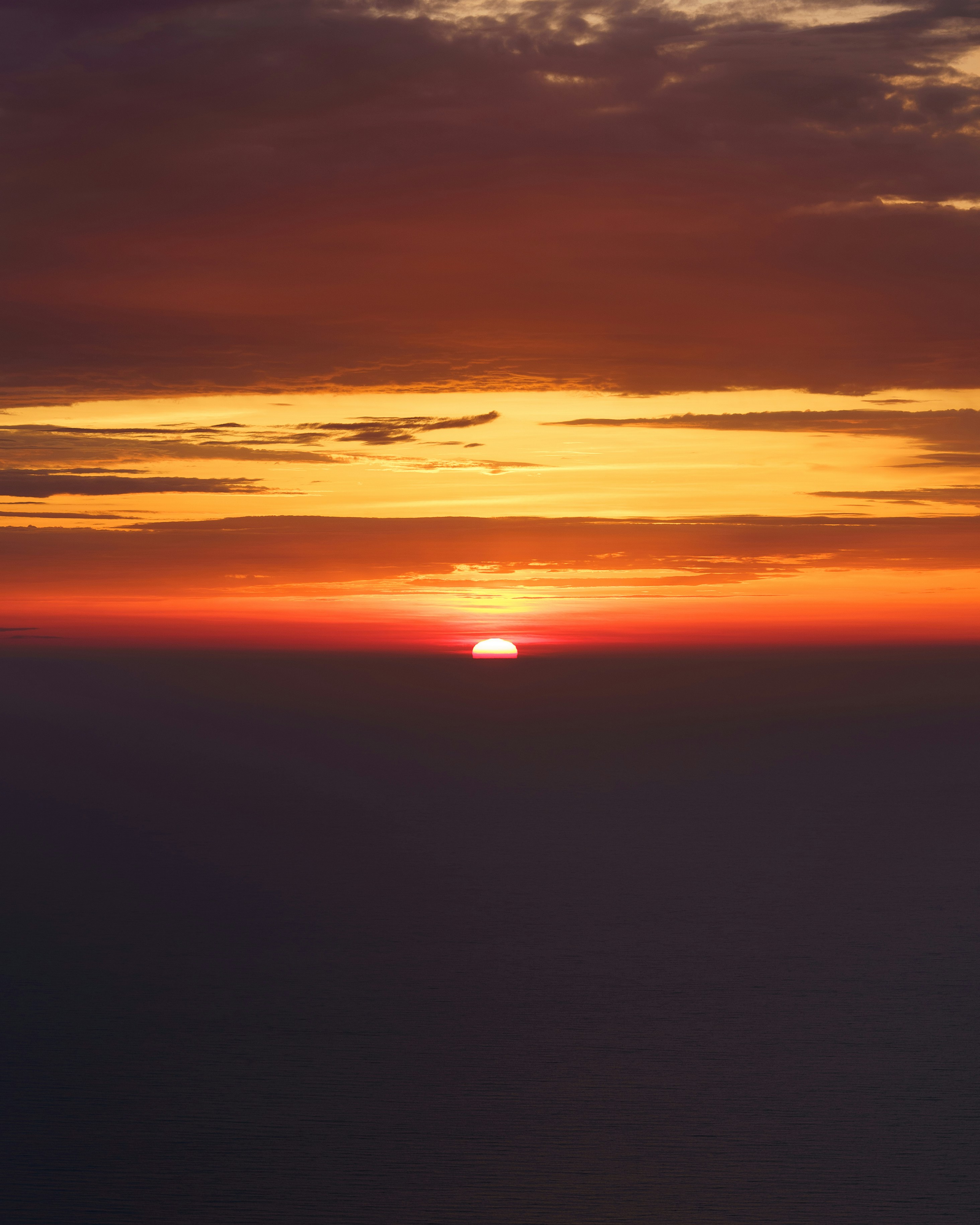 a sunset over a body of water
