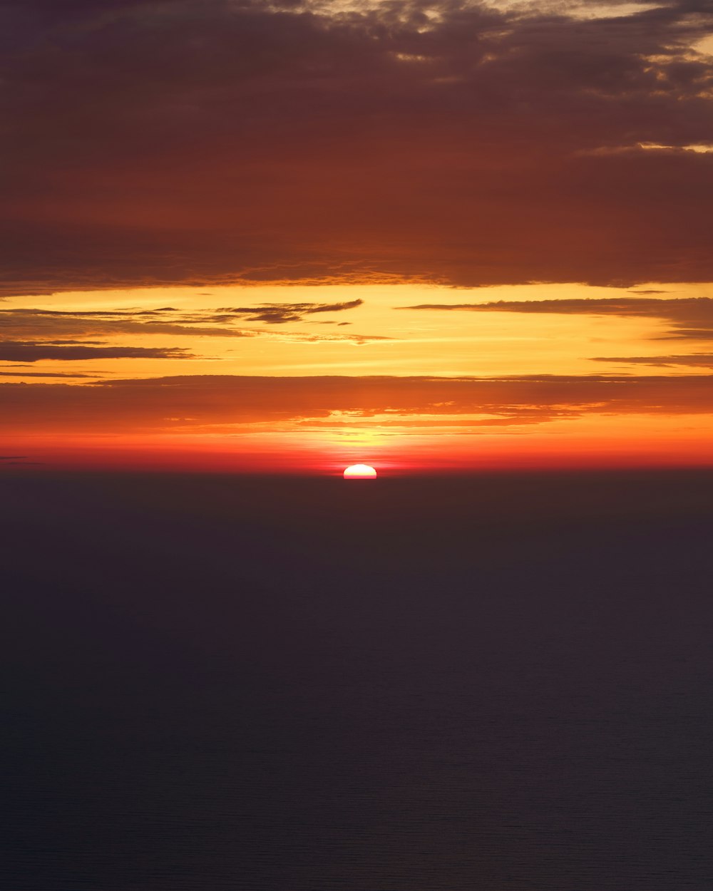 a sunset over a body of water