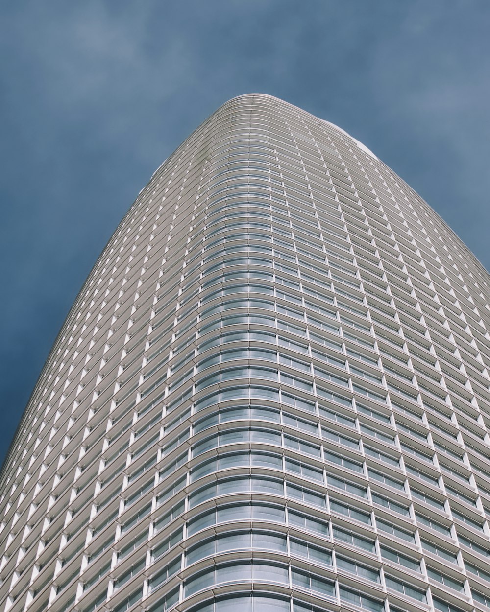 a very tall building with a sky background