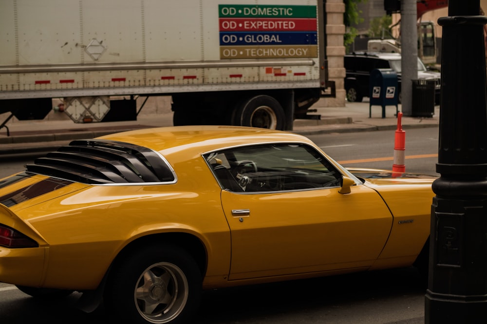 a yellow car parked on the side of the road