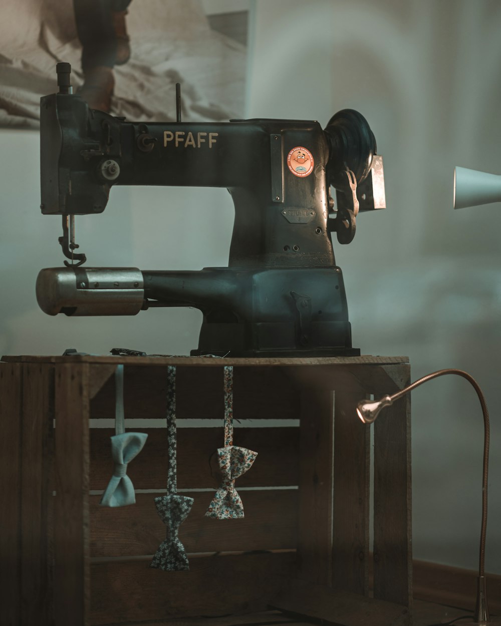 a sewing machine sitting on top of a wooden box