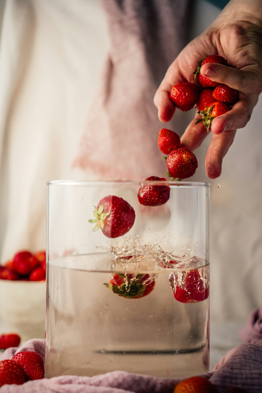 red strawberries in clear drinking glass