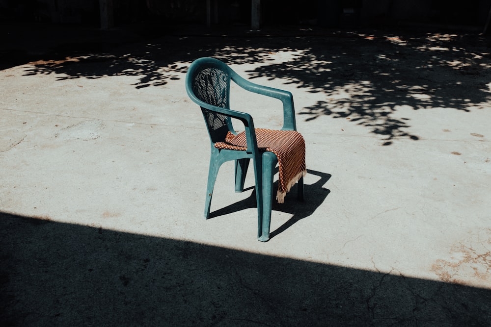 green and brown wooden bench on gray concrete floor