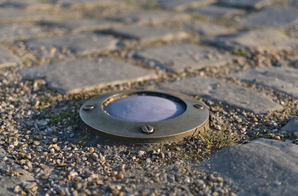 a close up of a metal object on the ground