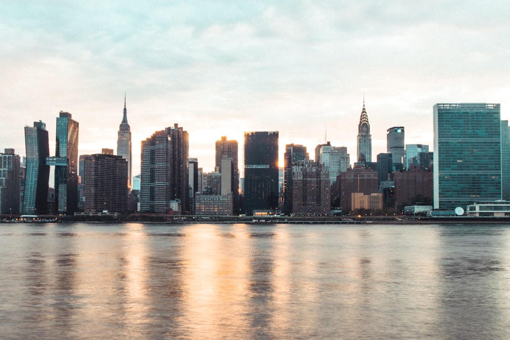 city skyline across body of water during daytime