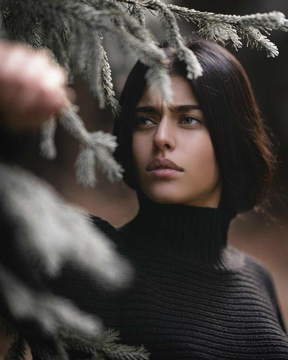 woman in black turtleneck sweater