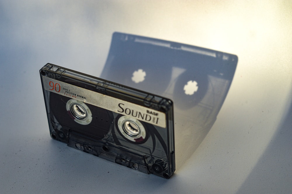 black cassette tape on white table
