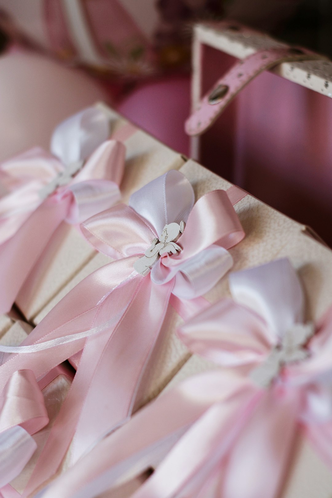 pink and white ribbon on brown paper