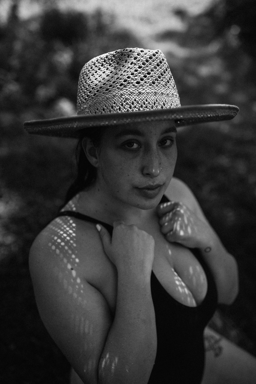 grayscale photo of woman wearing sun hat