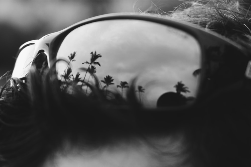 grayscale photo of black framed sunglasses