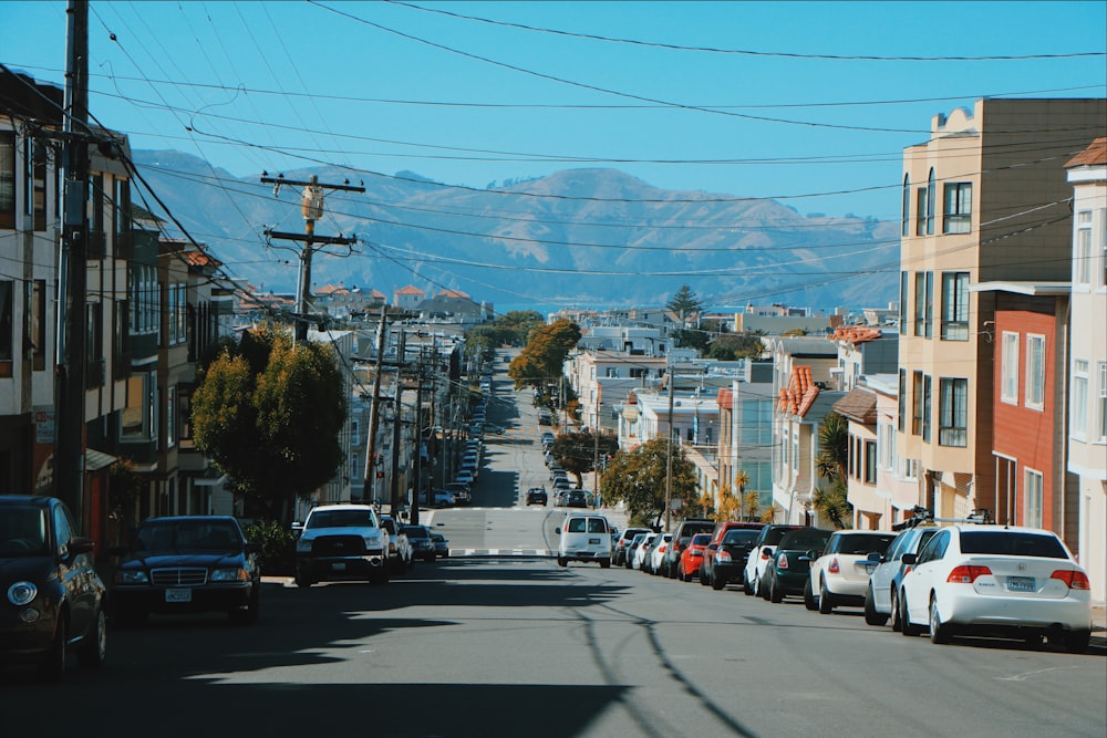 a city street with cars parked on both sides