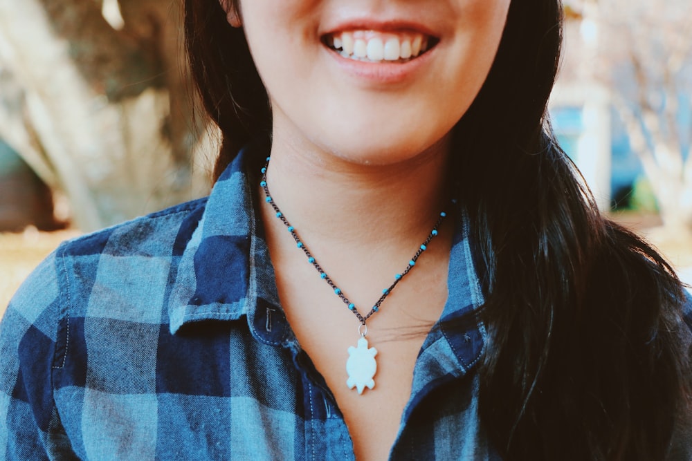 woman in blue and white stripe button up shirt