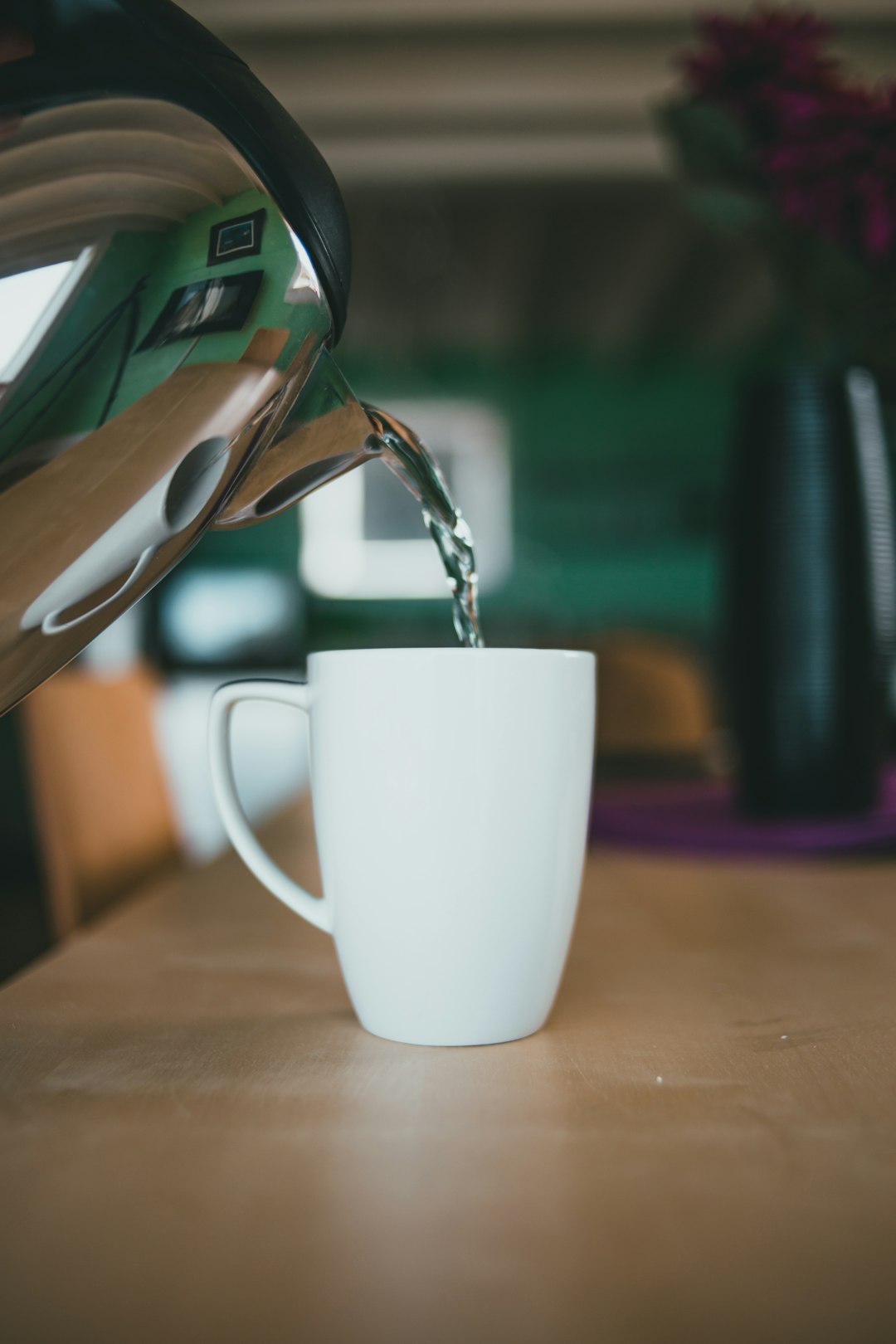 white ceramic mug on brown wooden table