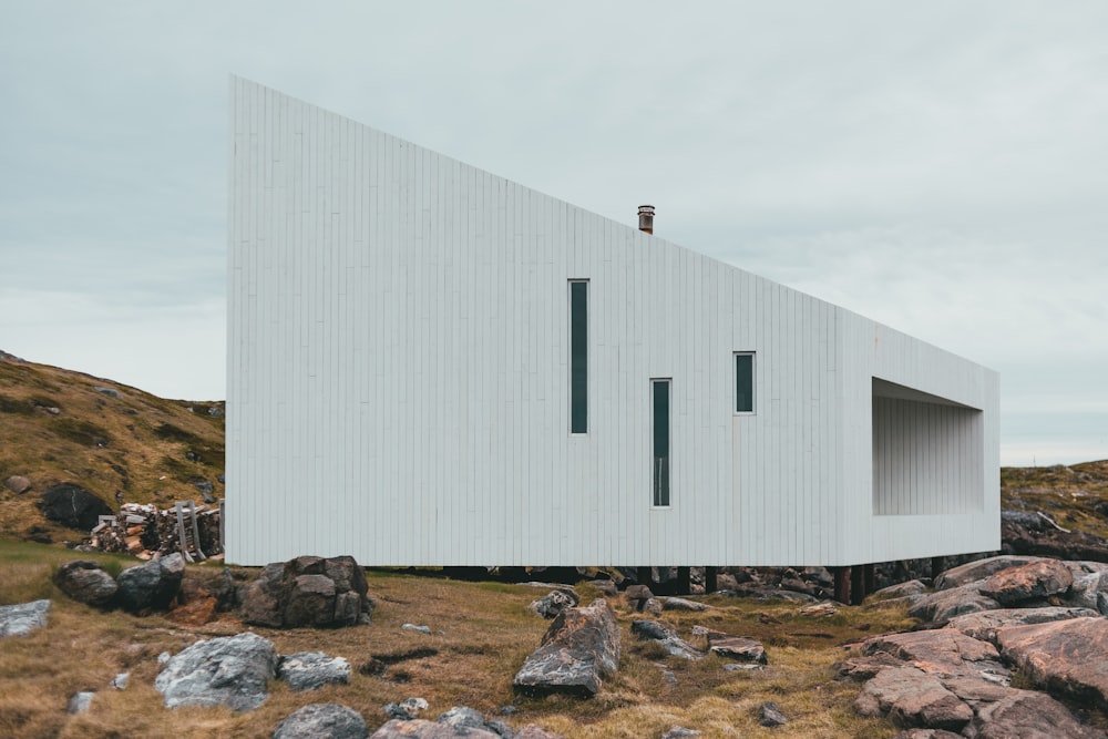 white concrete building near body of water during daytime