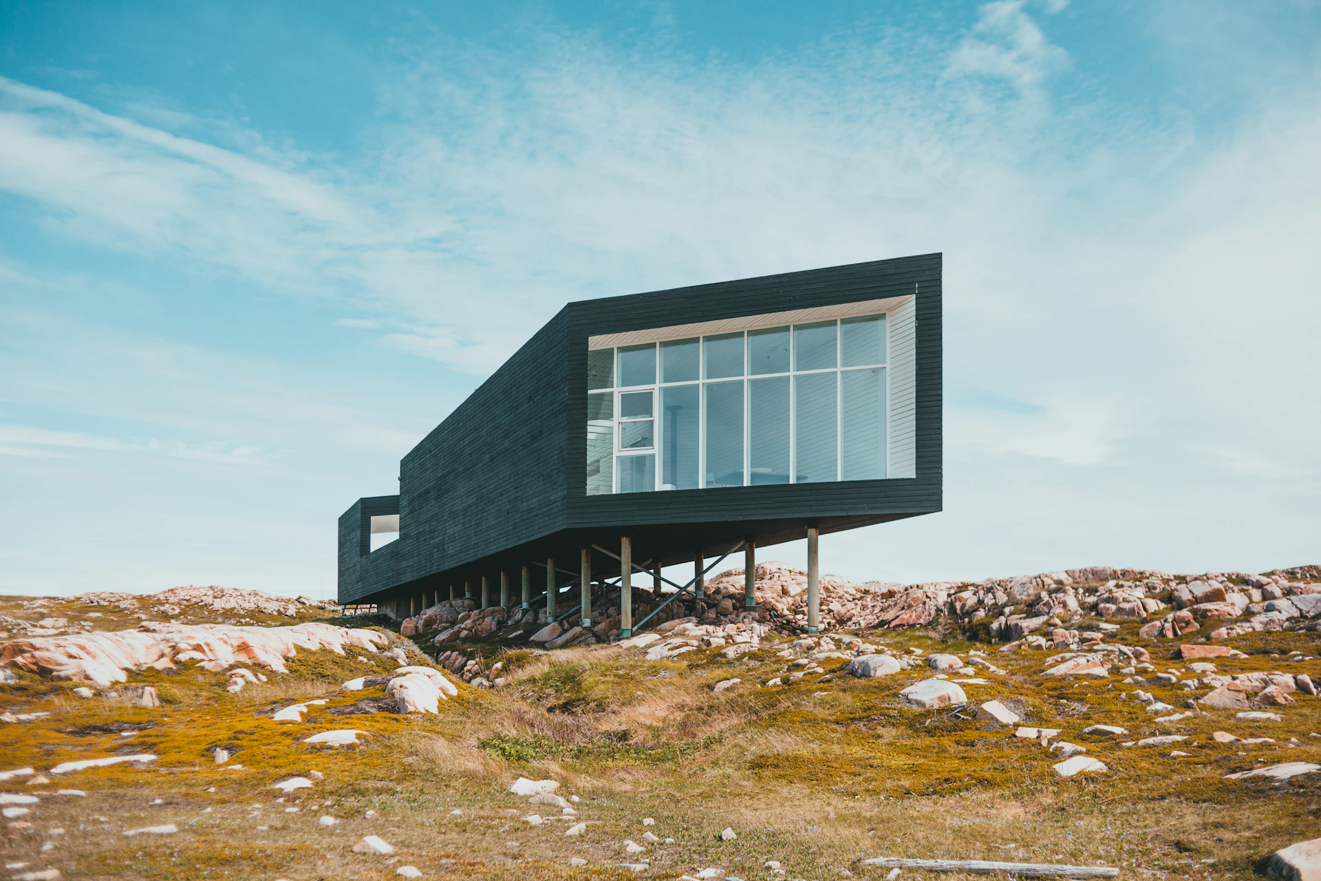 black and white wooden house under blue sky during daytime
