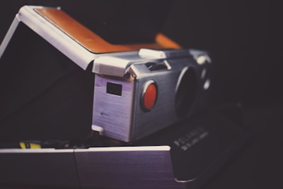 Close-up of a photo mirror displaying a freshly taken instant photo.