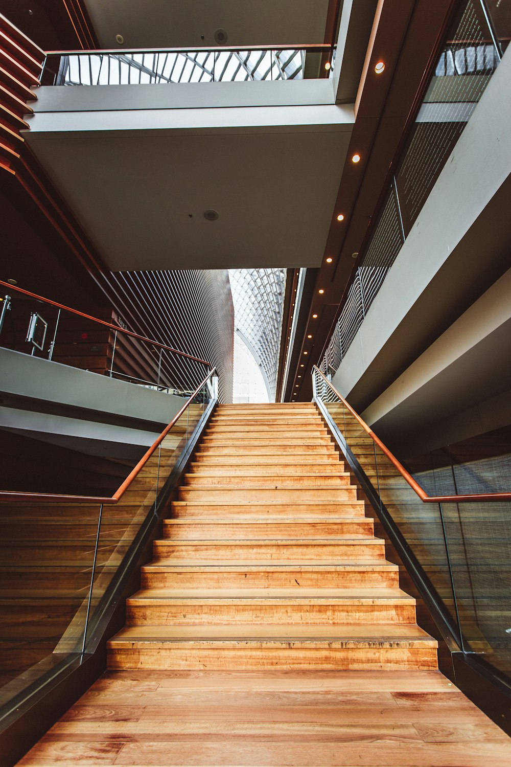 a stair case with wooden steps leading up to a second floor