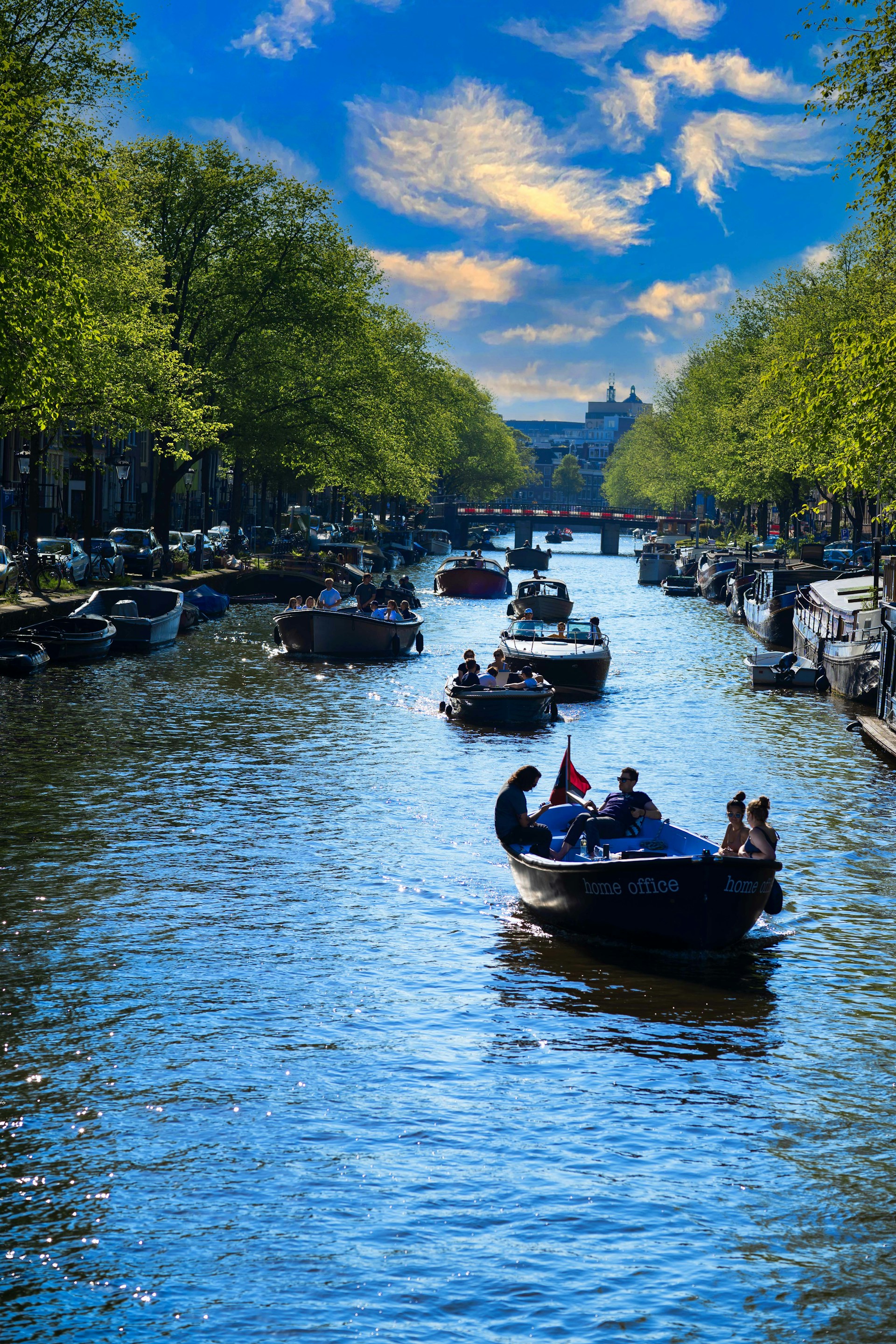 a group of people riding on top of a boat down a river