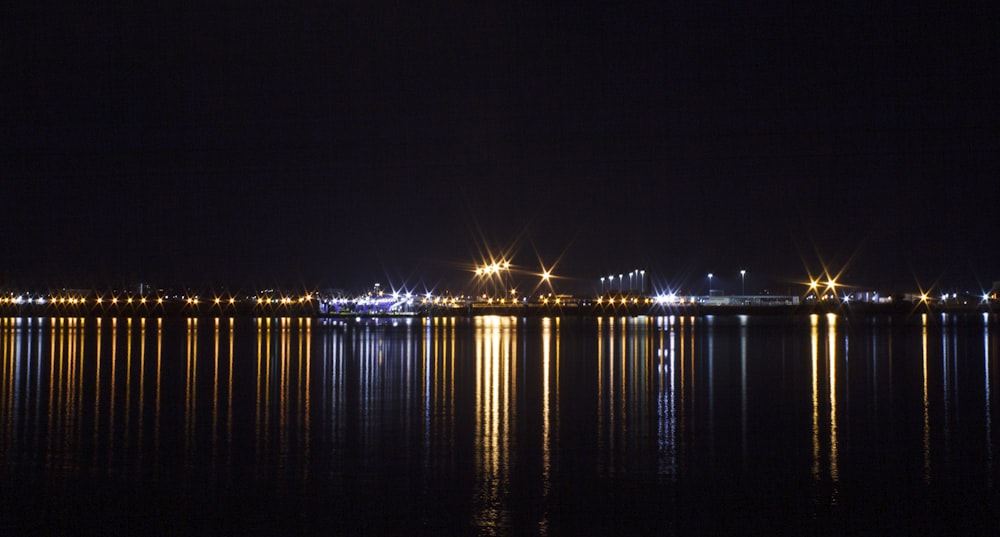 a large body of water with a city in the background