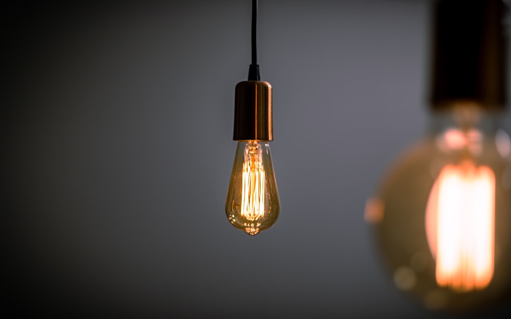 a couple of light bulbs hanging from a ceiling