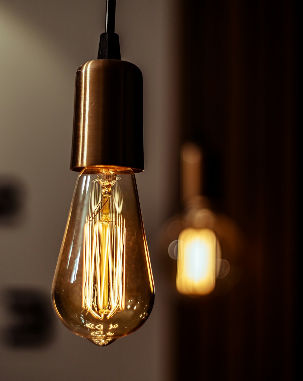 a light bulb hanging from a ceiling in a room